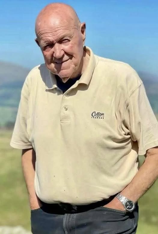 Meirion Williams standing outdoors beneath a blue sky